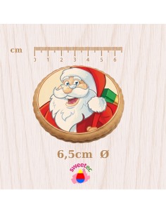 Ready-made 6.5cm chocolate biscuit with edible print of Santa Claus holding a gift. Ideal for festive candy bars.