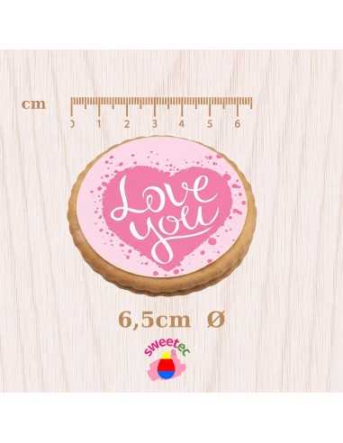6.5cm chocolate biscuit with edible print of a pink heart with the text Love You, shown with a cm ruler scale. Ideal for express