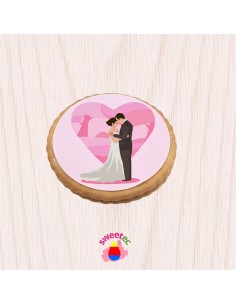 6.5cm chocolate biscuit with edible print of a bride and groom on a clean white background. Ideal for a wedding.